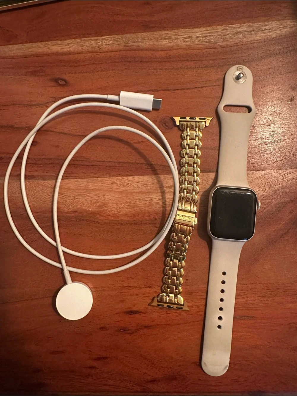 Apple Watch with white Sport Band and Gold Link Bracelet